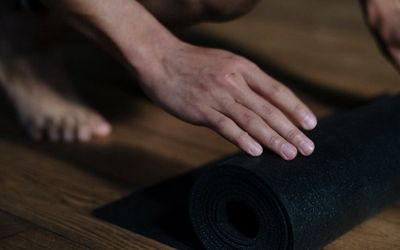 Minimalist workout space with a yoga mat and natural light.